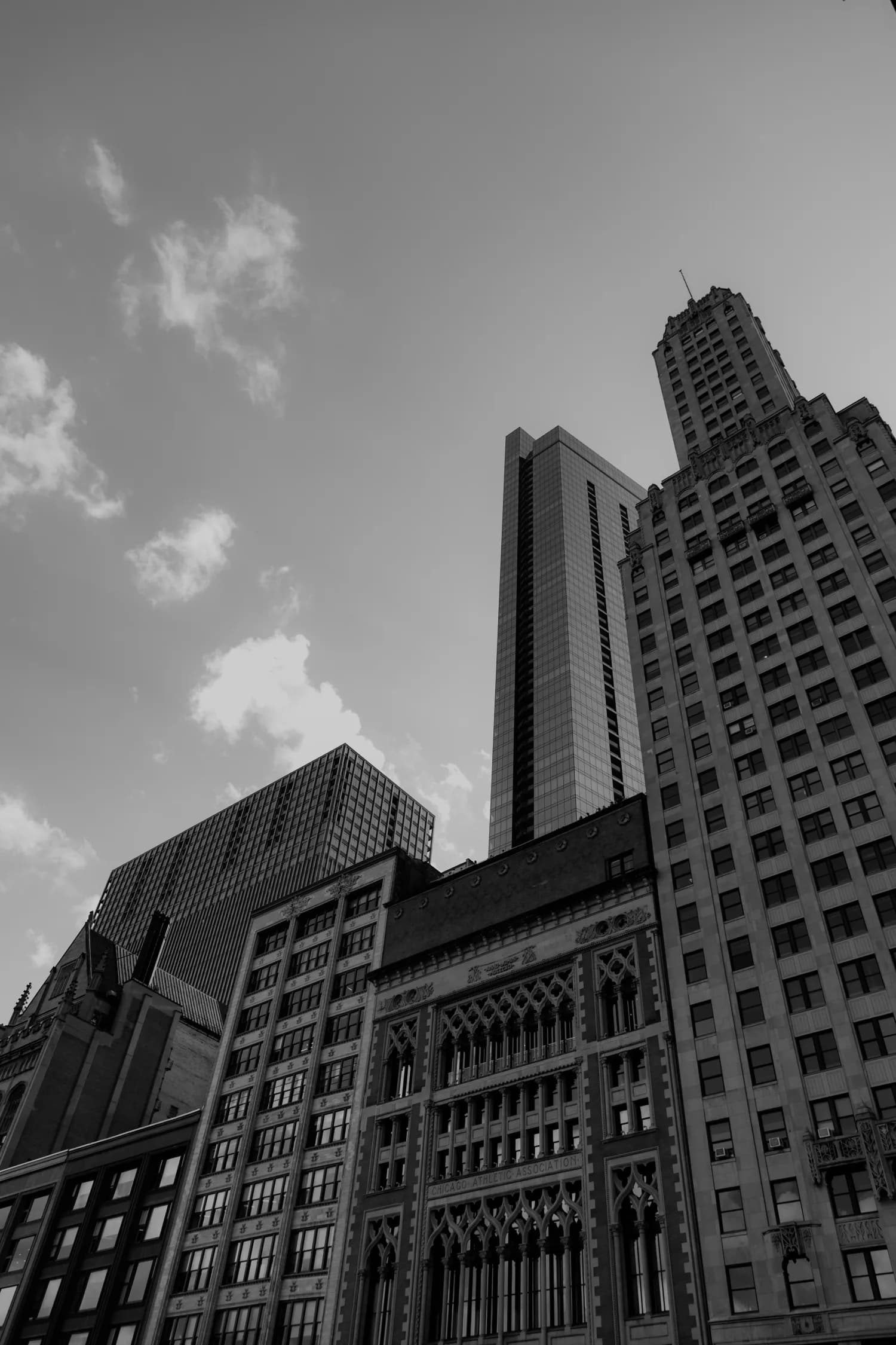 Black-and-white view of Chicago towers from street level