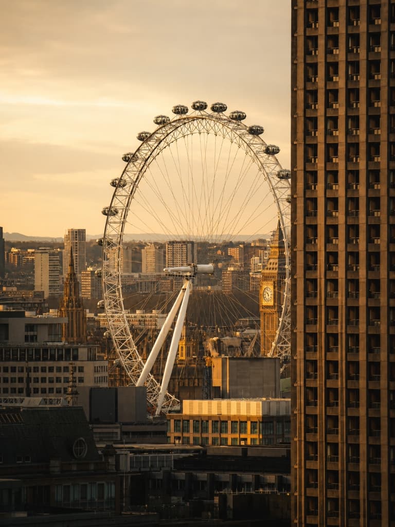 London Eye framed by modern and classic architecture